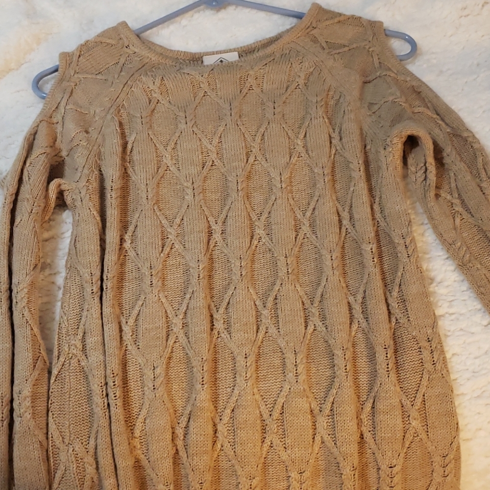 beige sweater with shoulder cut outs